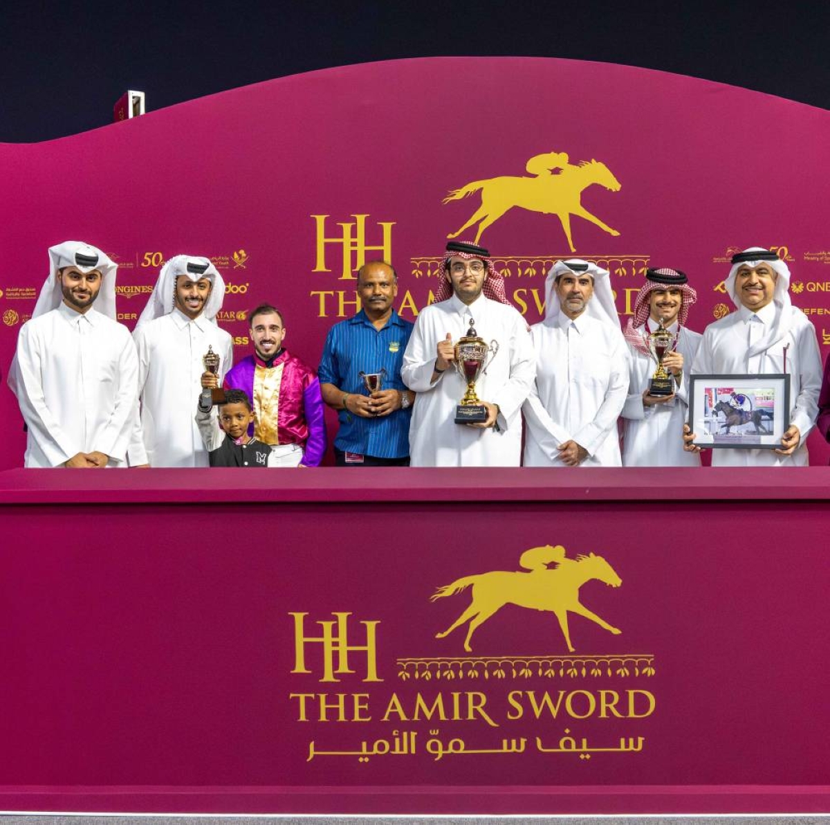 Connections of Hadi De Carrere celebrate after the nine-year-old bay won the Purebred Arabian Open Handicap Cup. 