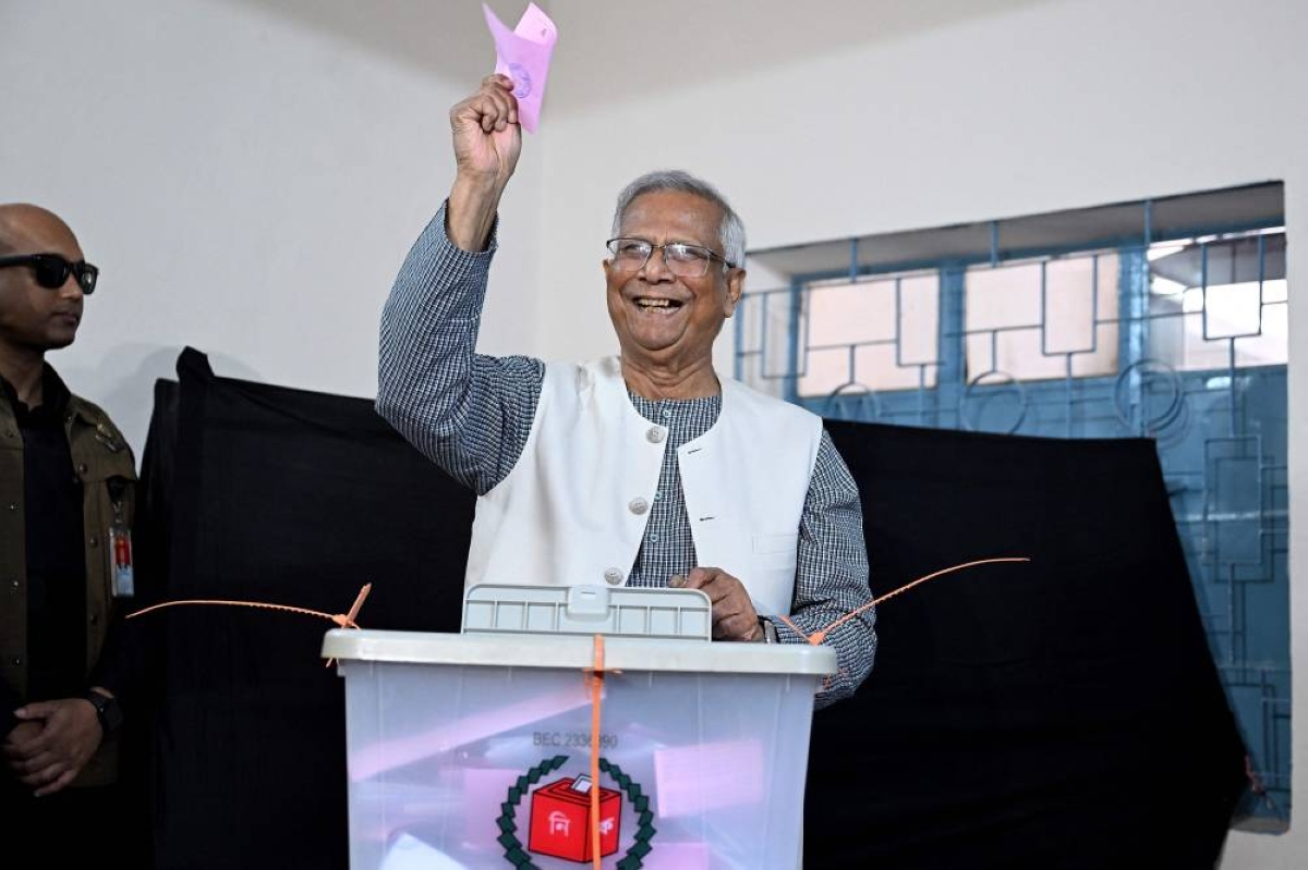 This handout photograph taken and released by Bangladesh's Chief Adviser Press Wing shows Chief Adviser of Bangladesh's Interim Government, Muhammad Yunus casting his ballot at a polling station during Bangladesh's general election in Dhaka on February 12, 2026. (Photo by HANDOUT / Bangladesh's Chief Adviser Press Wing / AFP) 