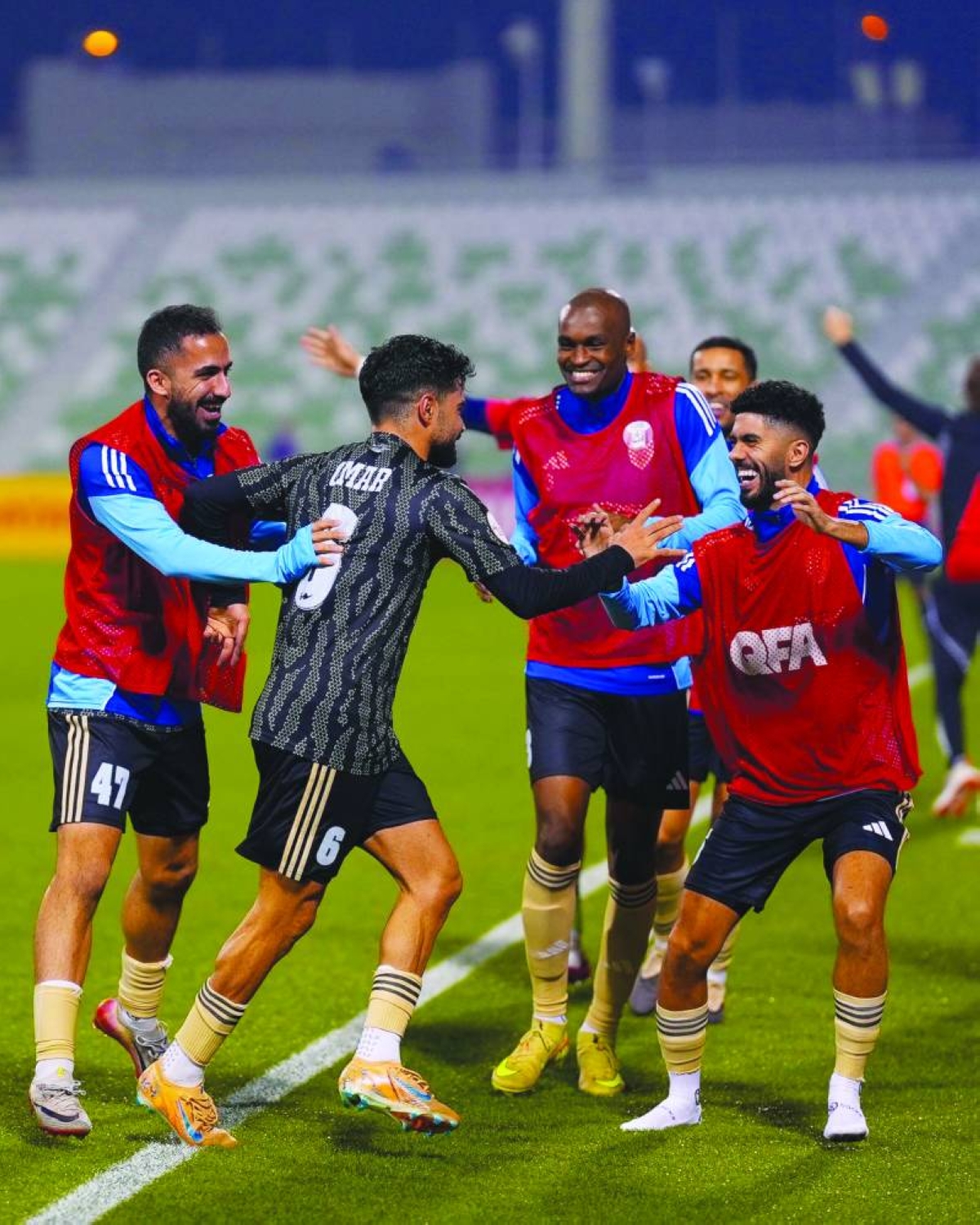 Al Wakrah’s Omar Salah (second left) celebrates with teammates after scoring team's first goal.