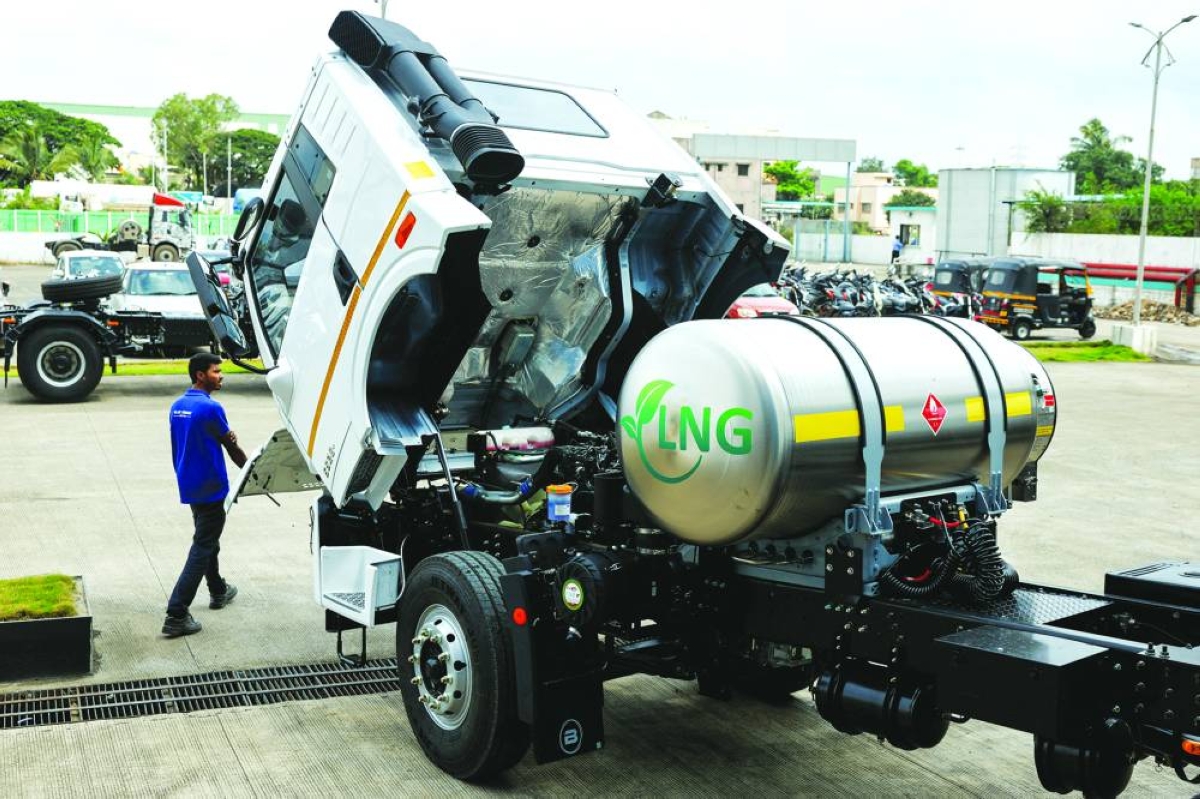 A man opens the hood of a liquefied natural gas truck to check the engine at the manufacturing facility in Pune. India’s overall buying could jump fourfold as the South Asian nation aims to lift the share of gas in its energy mix to 15% from 6% by the end of the decade.