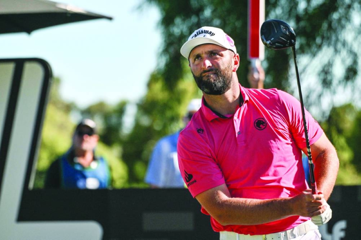 Legion XIII player Jon Rahm from Spain hits a tee shot during the LIV Golf Adelaide at The Grange Golf Club in Adelaide on February 14, 2026. (AFP)