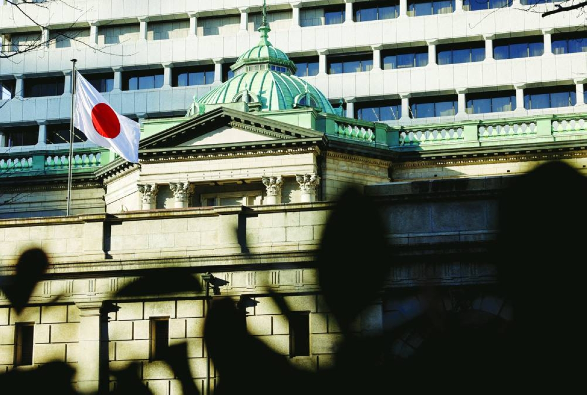 
A Japanese flag flutters atop the Bank of Japan headquarters in Tokyo in a file photo. (Reuters) 