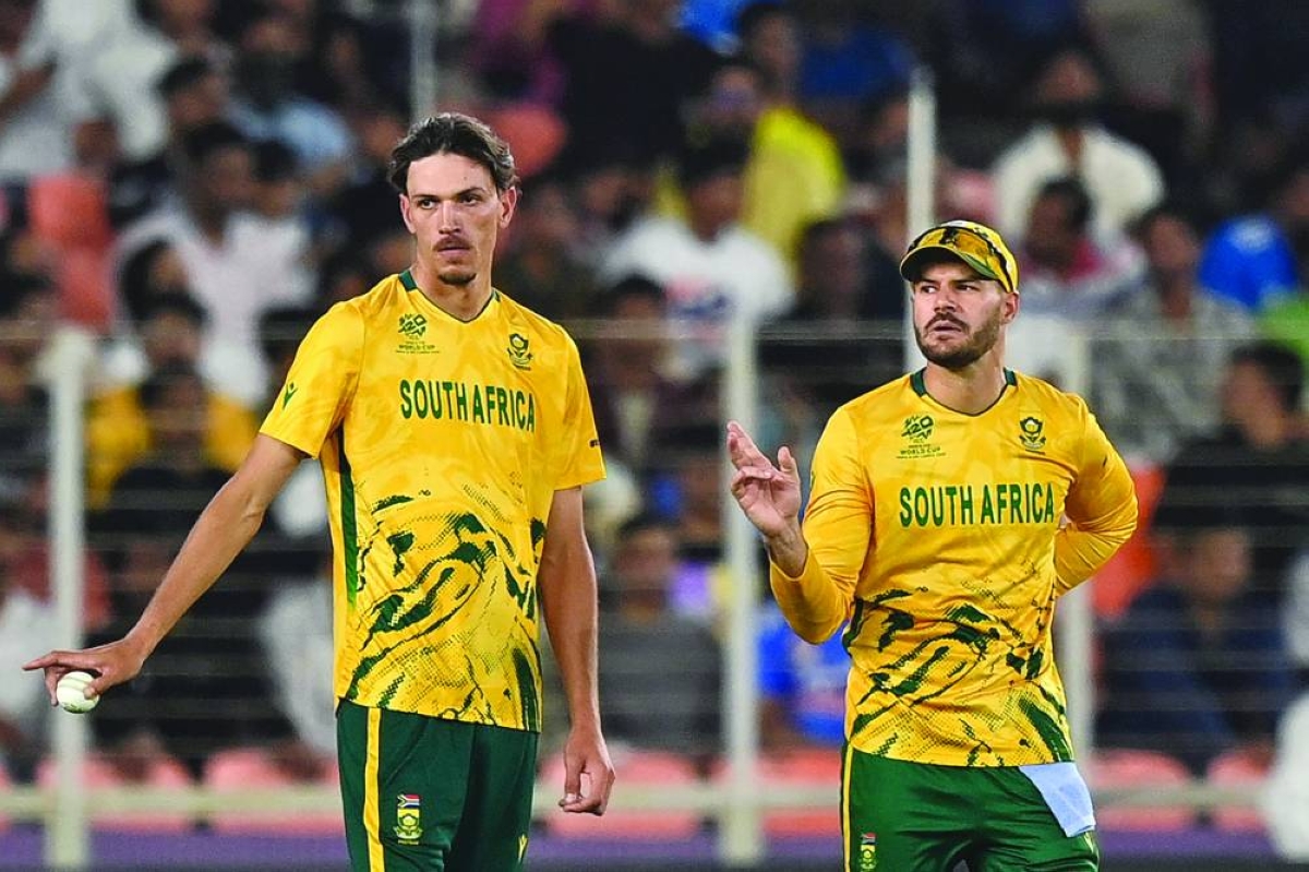 South Africa's Marco Jansen (L) gestures alongside captain Aiden Markram during the 2026 ICC Men's T20 Cricket World Cup group stage match between New Zealand and South Africa at the Narendra Modi Stadium in Ahmedabad on February 14, 2026. (Photo by Shammi MEHRA / AFP)