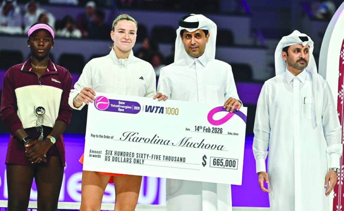 Qatar Tennis Federation President Nasser al-Khelaifi presents the winner’s cheque to Karolina Muchova after she won the Qatar TotalEnergies Open in Doha yesterday. Pictures: Noushad Thekkayil