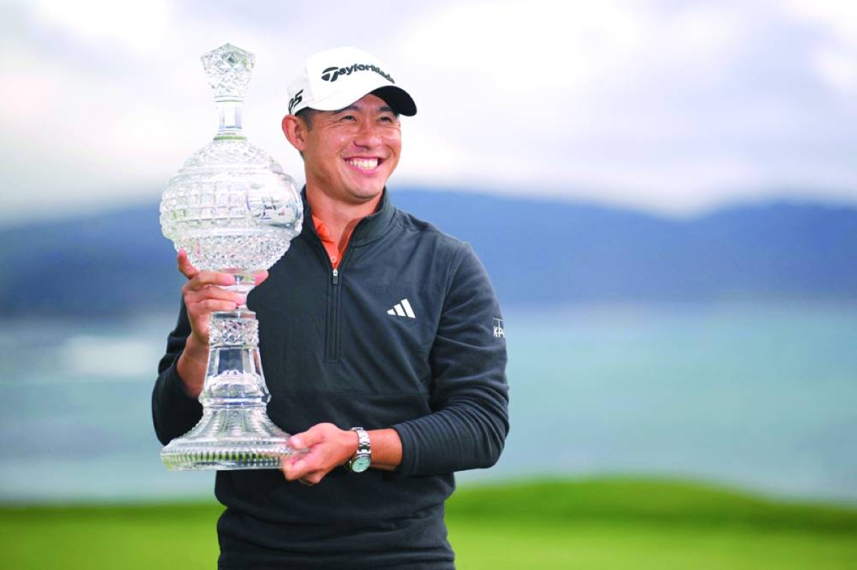 Collin Morikawa of the United States poses with the trophy after winning the AT&T Pebble Beach Pro-Am 2026 at Pebble Beach Golf Links Monday. (AFP)