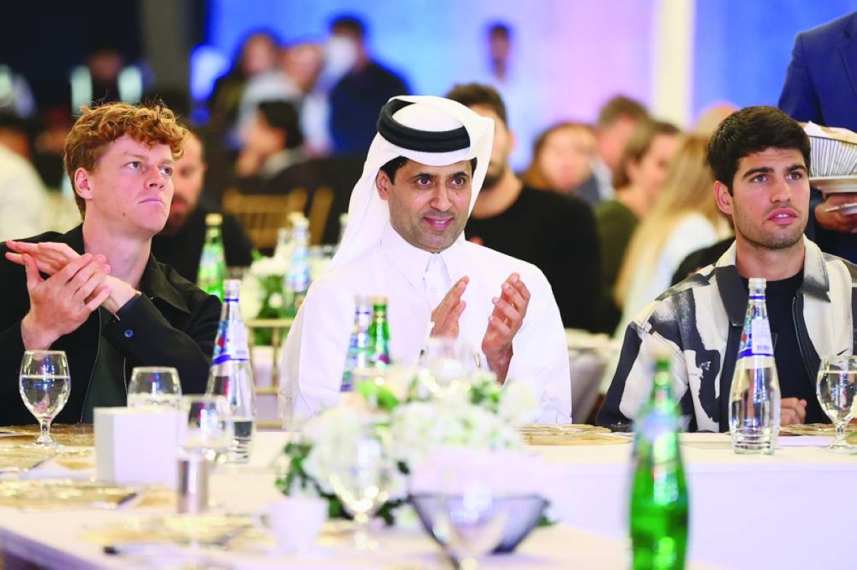 Qatar Tennis Federation President Nasser Al-Khelailfi is seen with world number one Carlos Alcaraz and world number two Jannik Sinner during the gala dinner at the Qatar ExxonMobil Open which started in Doha on Monday.