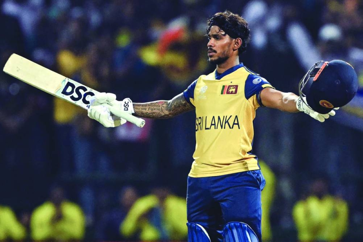 Sri Lanka's Pathum Nissanka celebrates after scoring a century (100 runs) during the 2026 ICC Men's T20 Cricket World Cup group stage match between Australia and Sri Lanka at Pallekele International Cricket Stadium in Kandy on February 16, 2026. (AFP)