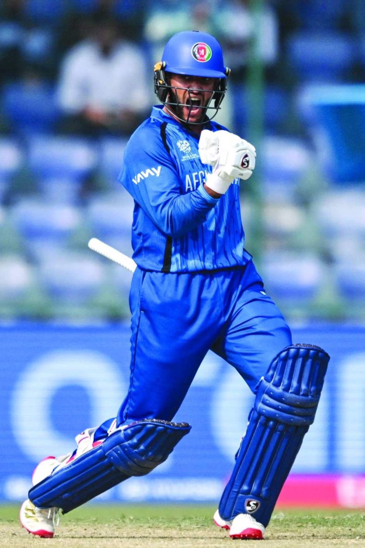 Afghanistan's Azmatullah Omarzai celebrates his team's win at the end of the 2026 ICC Men's T20 Cricket World Cup group stage match between Afghanistan and United Arab Emirates at the Arun Jaitley Stadium in New Delhi on February 16, 2026. (AFP)