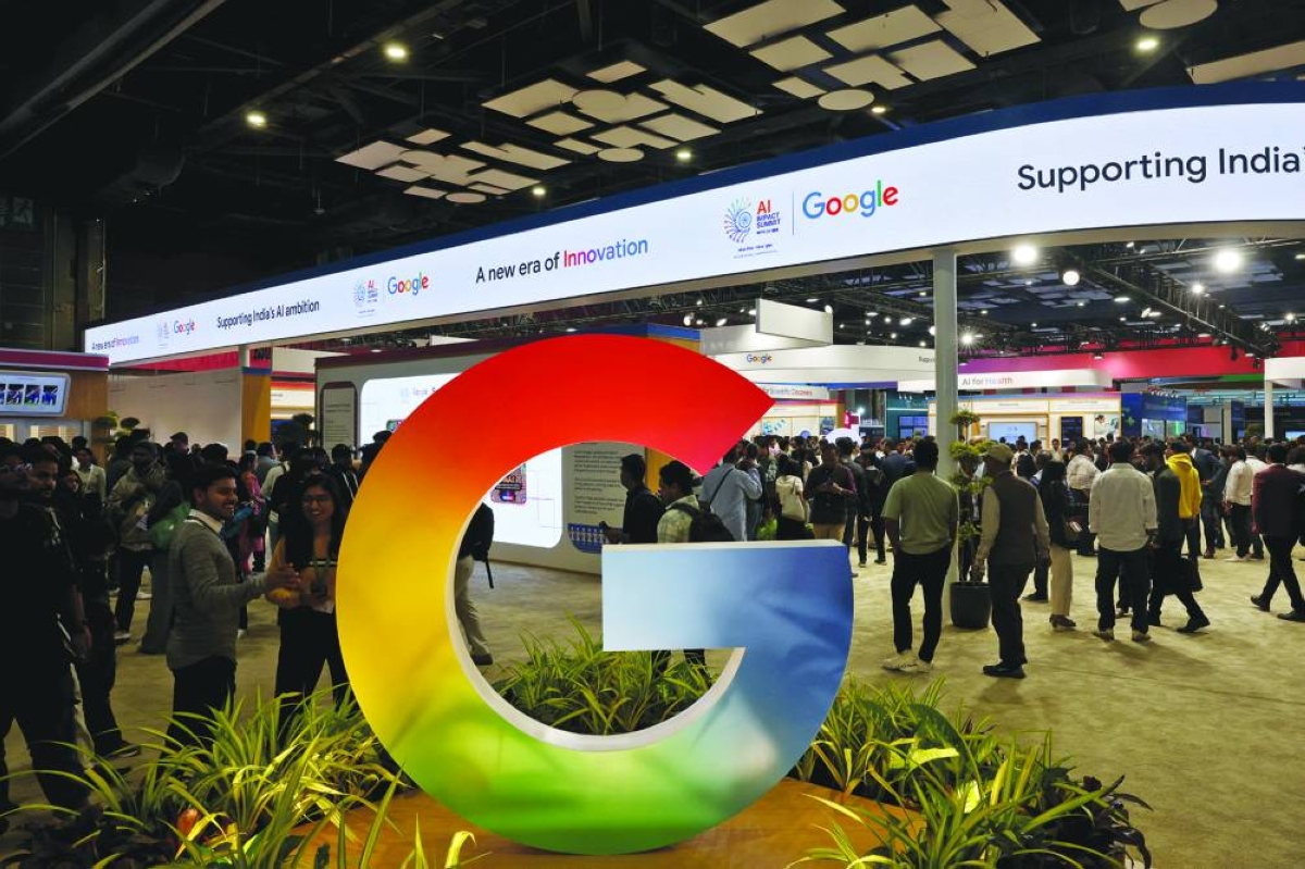 Visitors walk near a logo of Google at Bharat Mandapam, one of the venues for AI Impact Summit, in New Delhi on Tuesday. Last year India leapt to third place — overtaking South Korea and Japan — in an annual global ranking of AI competitiveness calculated by Stanford University researchers.