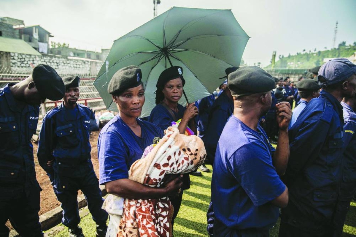(FILES) A Congolese police officer holds a baby during an enrollment of civilians, police officers, and former members of the Armed Forces of the Democratic Republic of Congo (FARDC) who allegedly decided to join the M23 movement voluntarily in Goma on February 23, 2025. A year after the M23 armed group seized Goma, residents of the major city in eastern DRC are living in a "catastrophic" situation, according to the Congolese government spokesperson.
On January 26, 2025, a million residents were sheltering in their homes when the Congolese army and its allies abandoned the capital of North Kivu province. Hundreds of Rwandan soldiers, allied with the anti-government armed group M23, had just crossed the border and entered the lakeside city, at the cost of intense fighting that left thousands dead.
Felix Tshisekedi, his successor as the DRC's president, accuses Kabila of being the brains behind the armed group. (Photo by JOSPIN MWISHA / AFP)