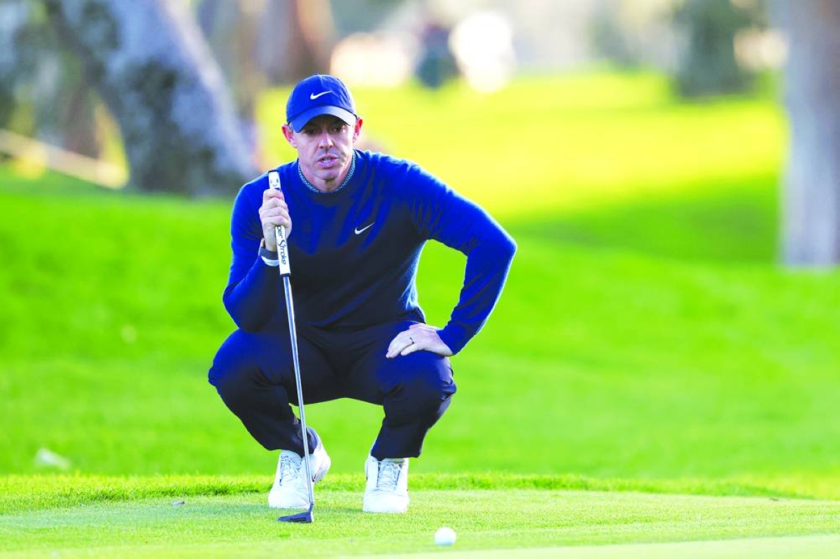 Feb 19, 2026; Pacific Palisades, California, USA;   Rory McIlroy lines up his putt on the 18th green during the first round of the The Genesis Invitational golf tournament at Riviera Country Club. Mandatory Credit: Kiyoshi Mio-Imagn Images
