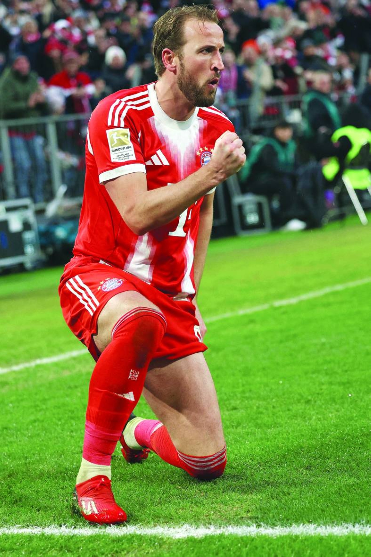 Bayern Munich's Harry Kane celebrates scoring against Eintracht Frankfurt in their Bundesliga match in Munich Saturday. (AFP)