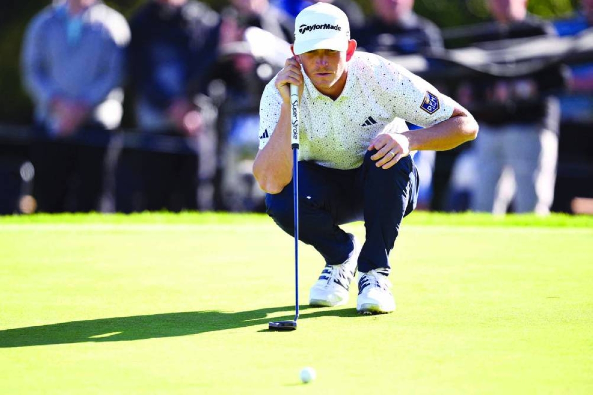 Jacob Bridgeman of the United States lines up a putt on the 16th green during the third round of The Genesis Invitational 2026 at Riviera Country Club in Pacific Palisades, California. (AFP)