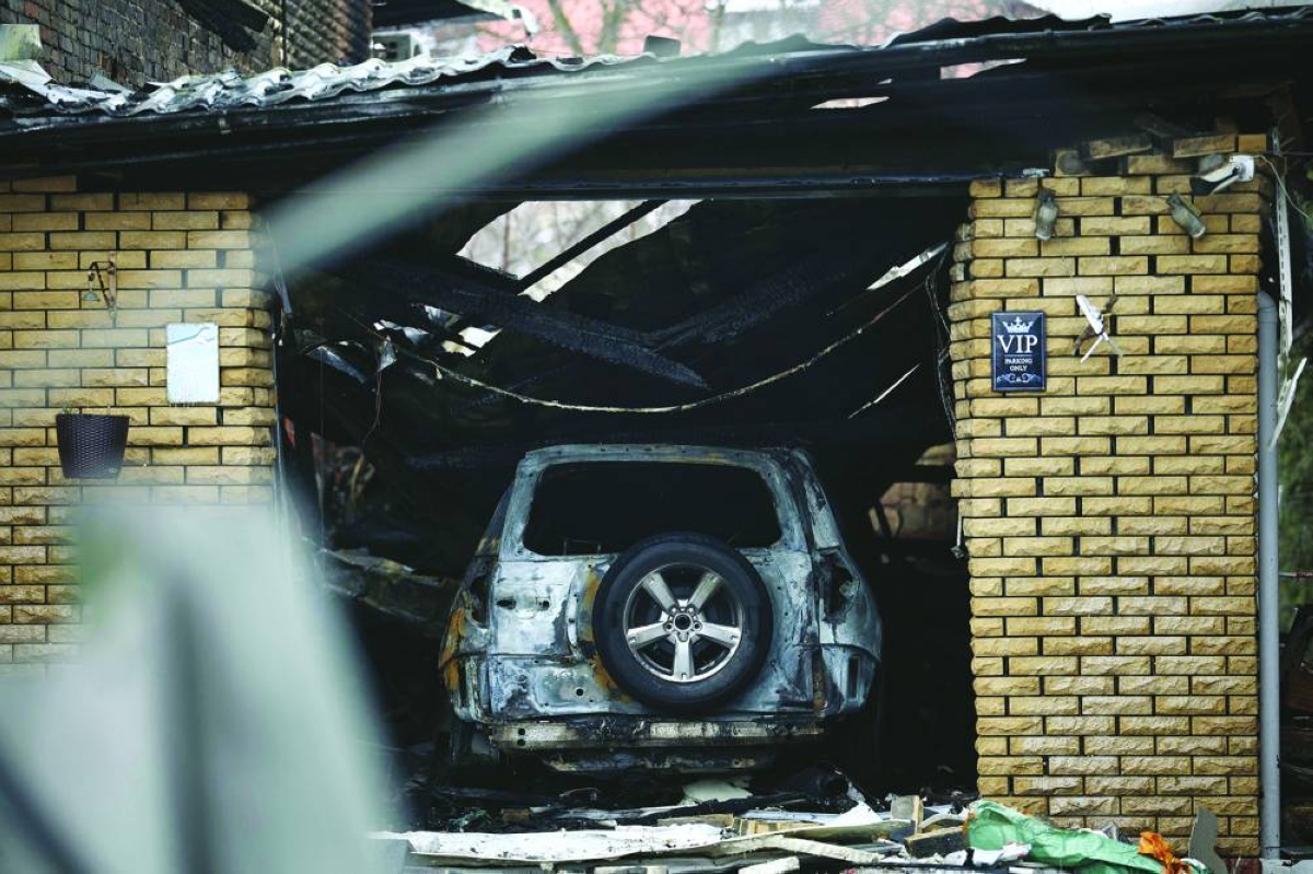 This photograph shows a burnt-out car in a damaged building following an air attack in Sofiivska Borshchagivka, Kyiv region Sunday, amid the Russian invasion of Ukraine.