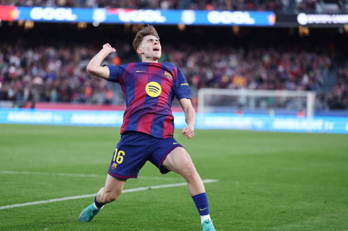 Barcelona's Fermin Lopez celebrates scoring his team's third goal during the La Liga match against Levante UD at Camp Nou Stadium in Barcelona Sunday. (AFP)