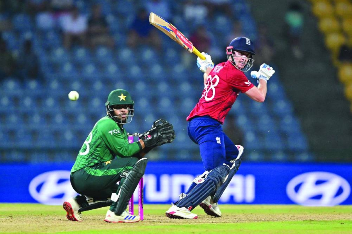 England's captain Harry Brook (right) plays a shot as Pakistan's wicketkeeper Usman Khan fields during the 2026 ICC T20 World Cup Super Eights match at the Pallekele International Cricket Stadium in Kandy on February 24, 2026. (AFP)