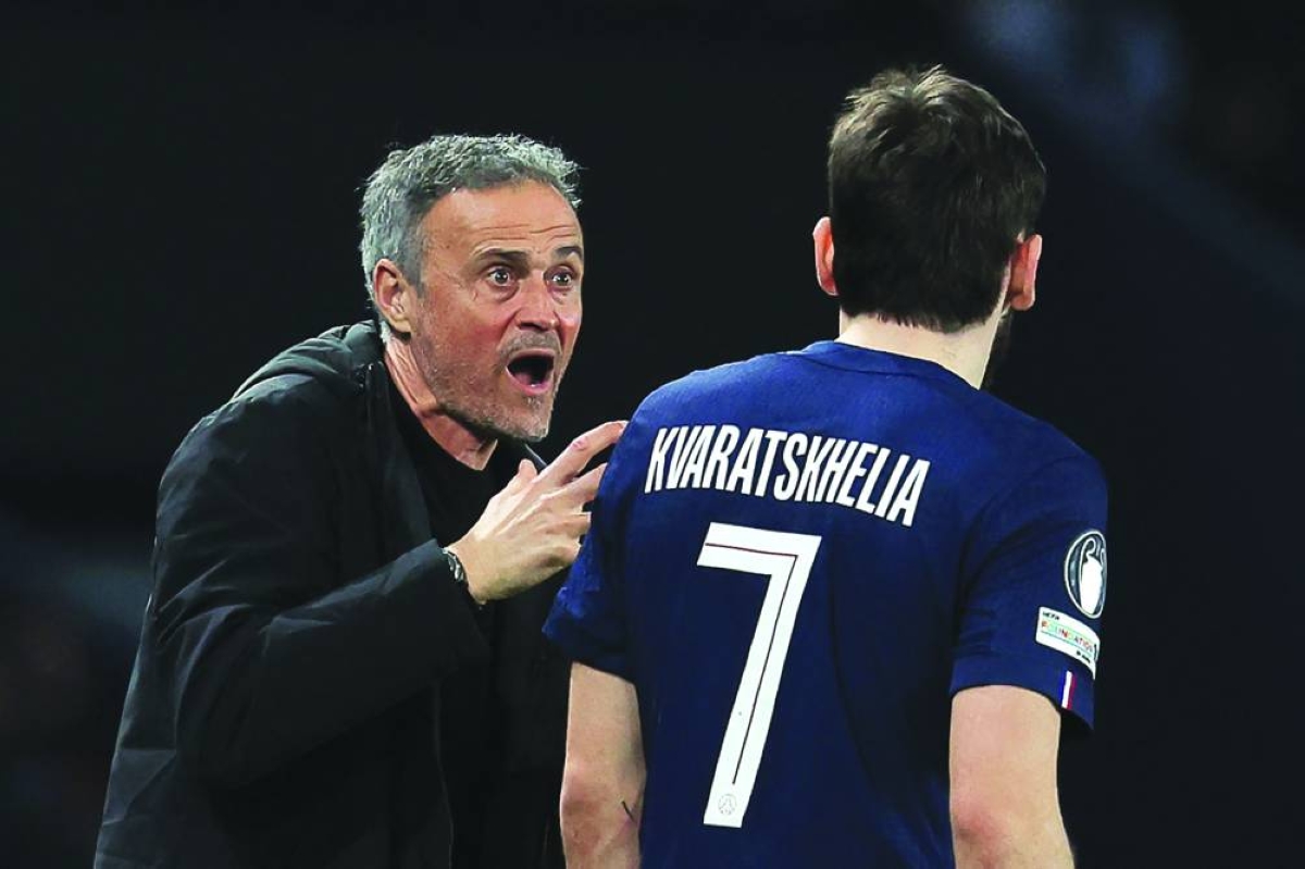 
Paris Saint-Germain’s coach Luis Enrique shouts instructions to forward Khvicha Kvaratskhelia during the Champions League play-off second leg match against Monaco in Paris. (AFP) 
