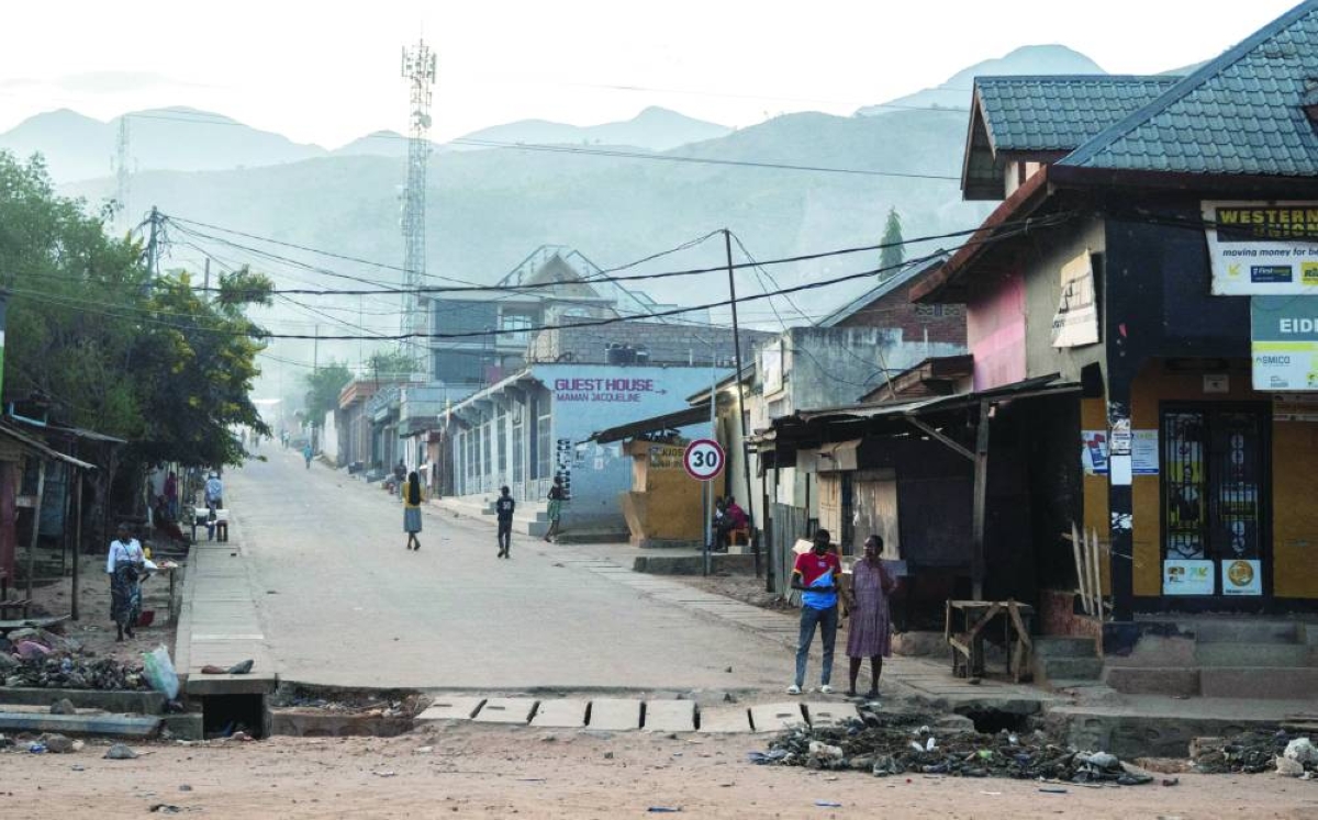 
File photo shows Congolese civilians walk after returning to their homes following displacement during renewed clashes between Alliance Fleuve Congo AFC/M23 and the Armed Forces of the Democratic Republic of the Congo, in Uvira town, South Kivu province, in DR Congo. 