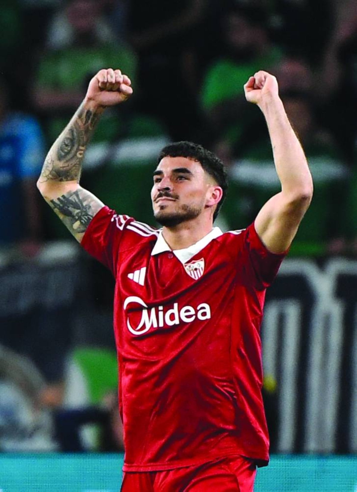 Sevilla’s Isaac Romero celebrates scoring his team’s second goal during the La Liga match against Real Betis at Benito Villamarin Stadium in Seville Sunday. (AFP)