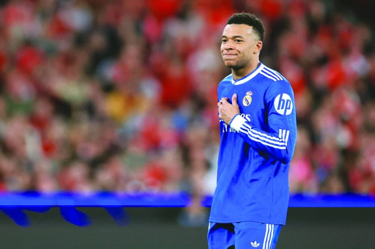 (FILES) Real Madrid's French forward #10 Kylian Mbappe reacts after missing a goal opportunity during the UEFA Champions League knockout round play-off first leg football match between SL Benfica and Real Madrid CF at Estadio da Luz in Lisbon on February 17, 2026. Kylian Mbappe, who has been suffering from a left knee injury since December 2025, is currently in Paris with Real Madrid's medical staff to "assess the progress" of his injury, but no "surgery" is planned "at this stage", AFP learned on March 2, 2026, from the French striker's entourage. (AFP)