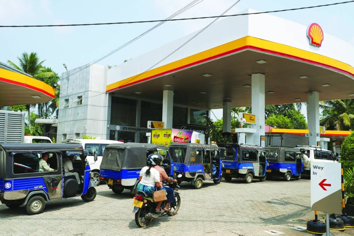 Vehicles queue at a fuel station as concerns grow over fuel supply following US-Israel conflict with Iran, in Ratnapura, Sri Lanka, Monday.