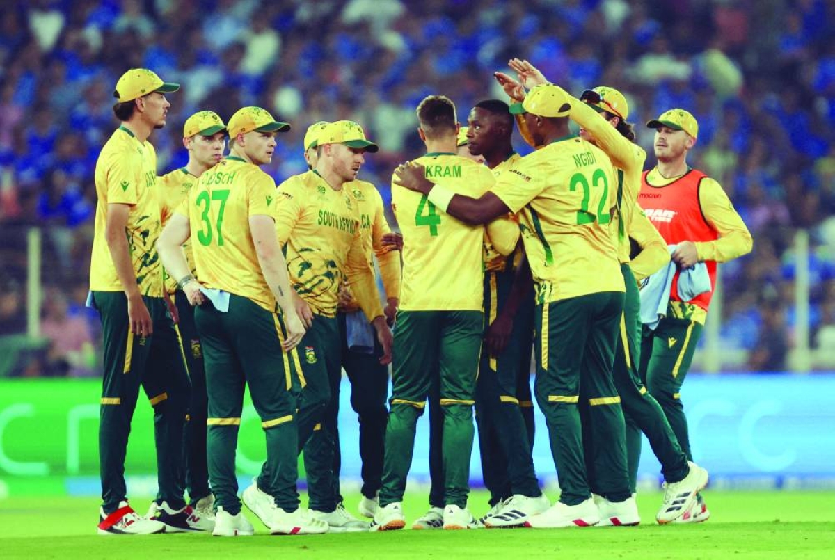 
South Africa’s Aiden Markram celebrates with team-mates after taking the wicket of India’s Ishan Kishan, caught out by Ryan Rickelton in Ahmedabad on February 22, 2026. (Reuters) 