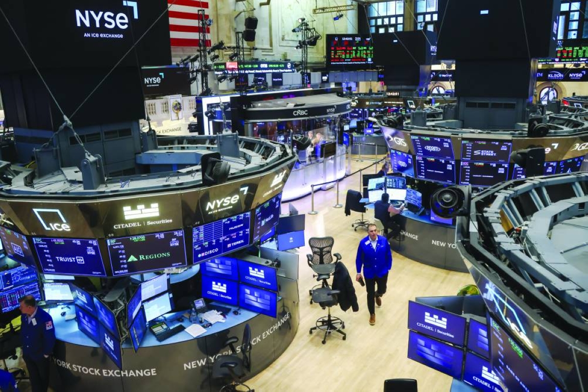 Traders work on the floor of the New York Stock Exchange. The S&P 500 on Monday ended little changed, erasing an early drop of 1.2% on the first market day after the US bombing of Iran sparked chaos in the Middle East. 