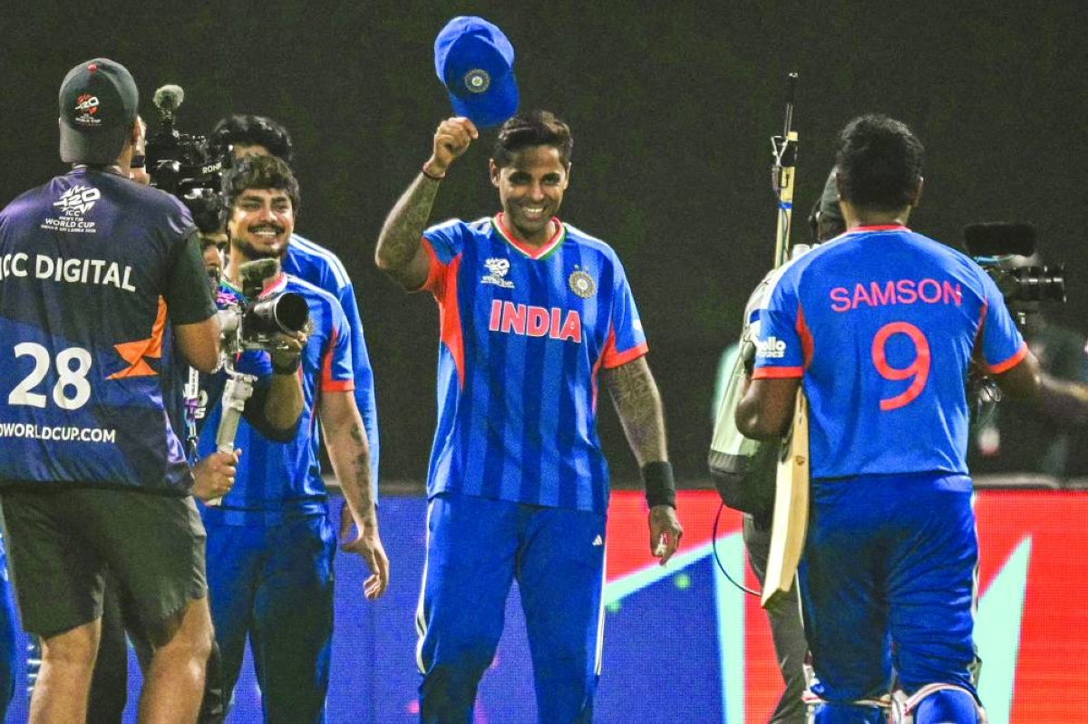 
India’s captain Suryakumar Yadav (centre) greets his teammate Sanju Samson (right) after their team’s win in the World Cup Super Eights match against West Indies in Kolkata on Sunday. (AFP) 
