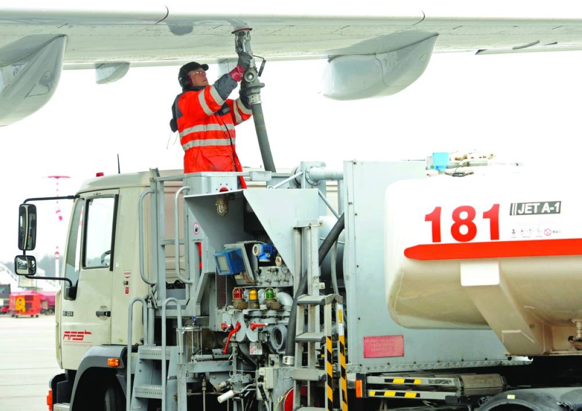 File Picture: A worker fills an Airbus jet with aviation fuel at Fuhlsbuettel airport in Hamburg. High risk premium on energy markets and the fears of supply disruptions have started acting on aviation fuel prices, even as airlines sector resort to aggressive hedging, which is increasingly becoming a strategic risk management tool.