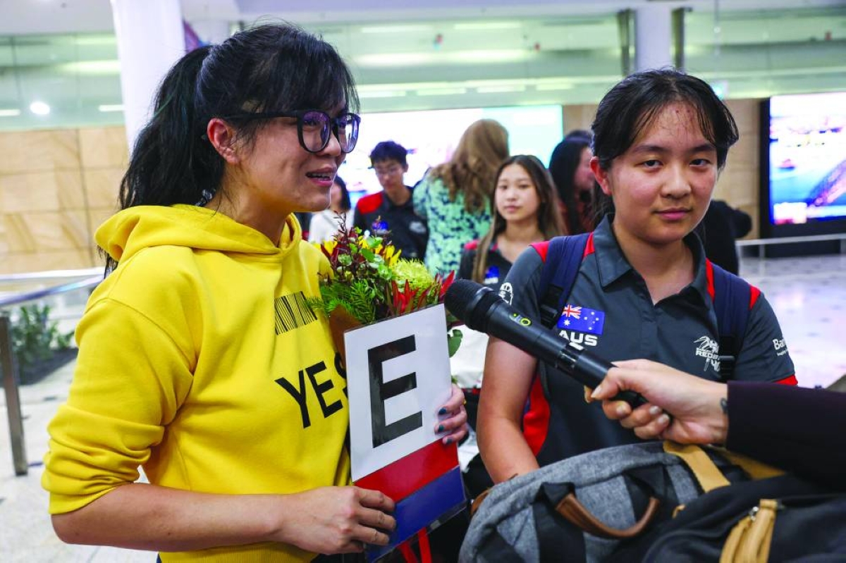 A passenger speaks to the press after disembarking from an Emirates flight coming from Dubai at Sydney Kingsford Smith International Airport, Wednesday.