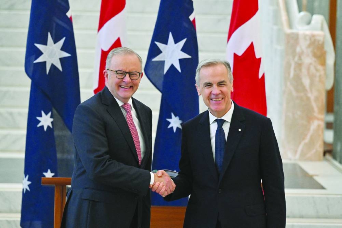 Australian Prime Minister Anthony Albanese shakes hands with Canada's Prime Minister Mark Carney at the Australian Parliament House, in Canberra, Australia, Thursday. (Reuters)
