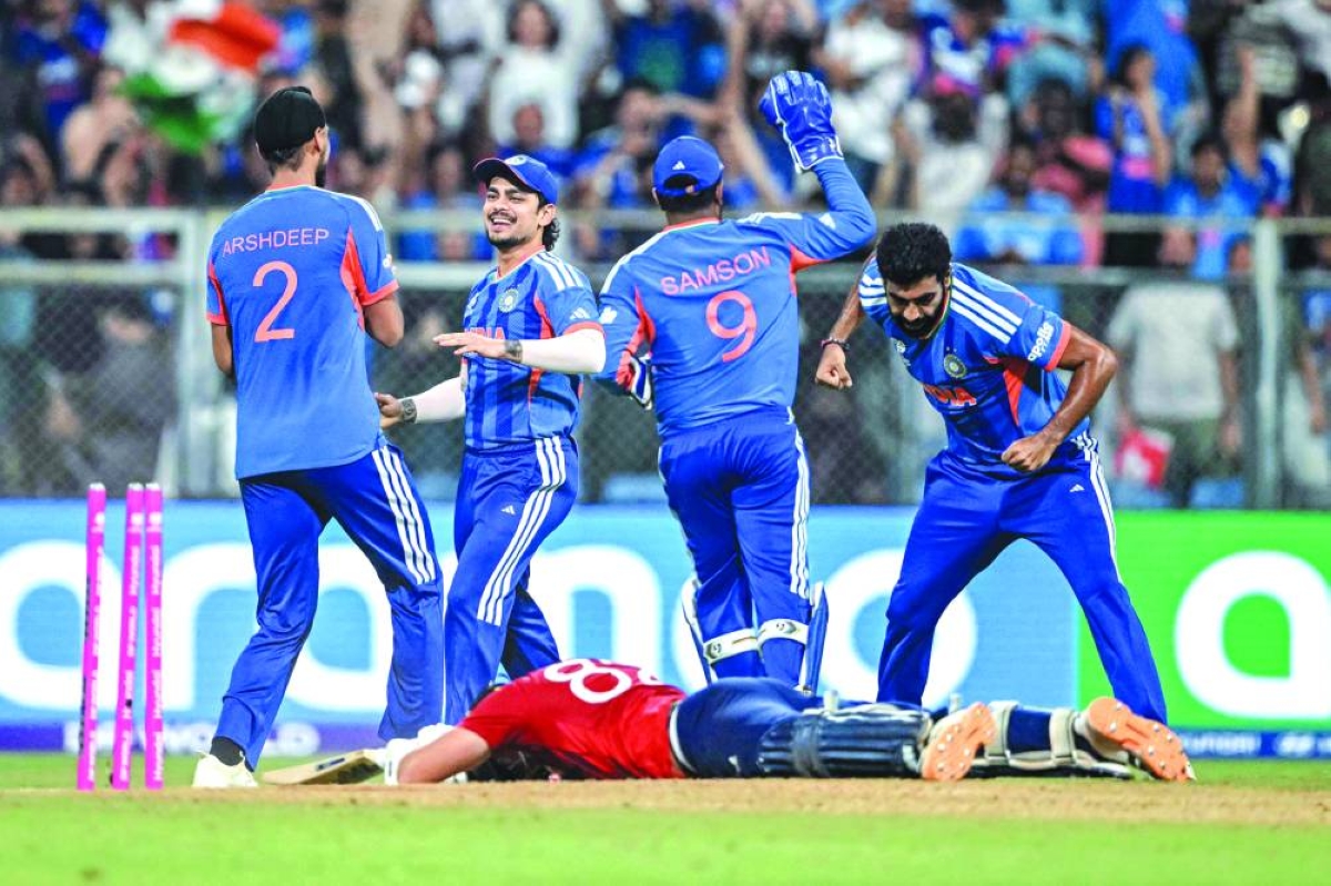 India’s players celebrate after Jacob Bethell of England is run out in the final over of the World Cup semi-final at the Wankhede Stadium in Mumbai Thursday. (AFP)
