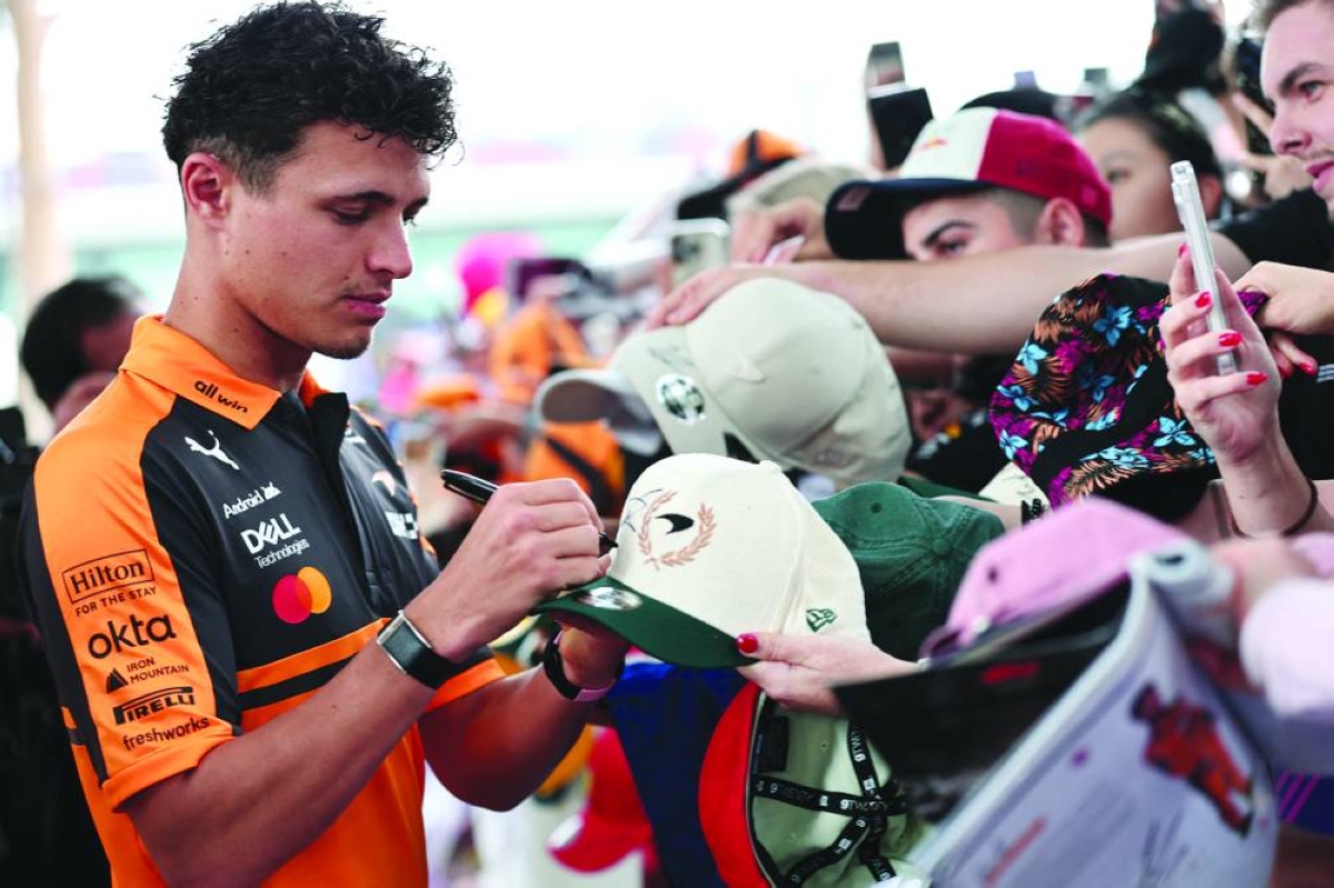 Formula One F1 - Australian Grand Prix - Albert Park Grand Prix Circuit, Melbourne, Australia - March 6, 2026
McLaren's Lando Norris with fans before practice REUTERS/Mark Peterson