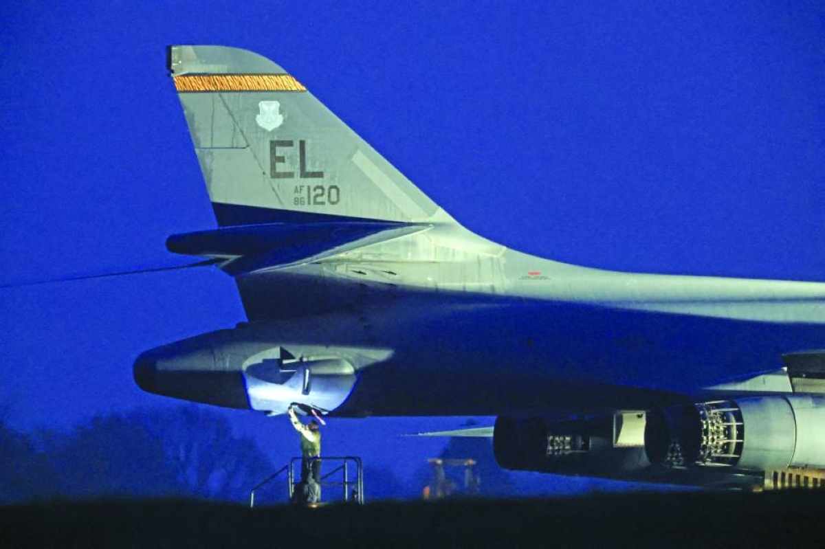 
Military personnel work on a USAF B1-B bomber after it landed at RAF Fairford airbase, which also hosts United States Air Force personnel, in Fairford, Britain, yesterday. (Reuters) 