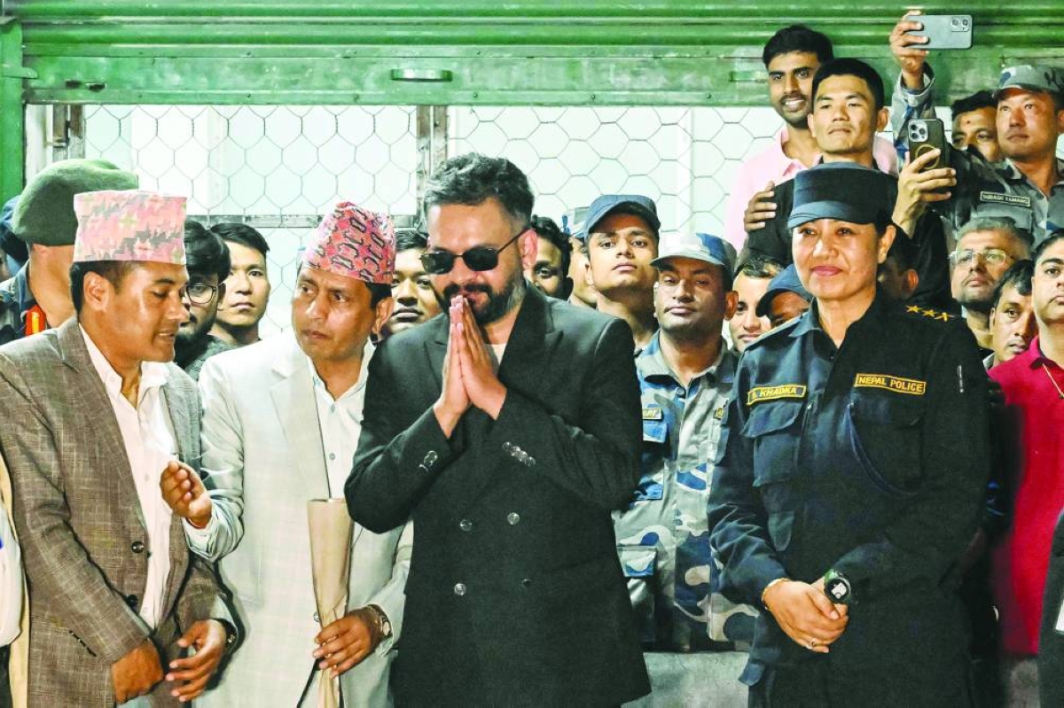 Rastriya Swatantra Party election candidate Balendra Shah (entre) greets supporters at the counting centre in Damak in Nepal's Jhapa district on Saturday. 