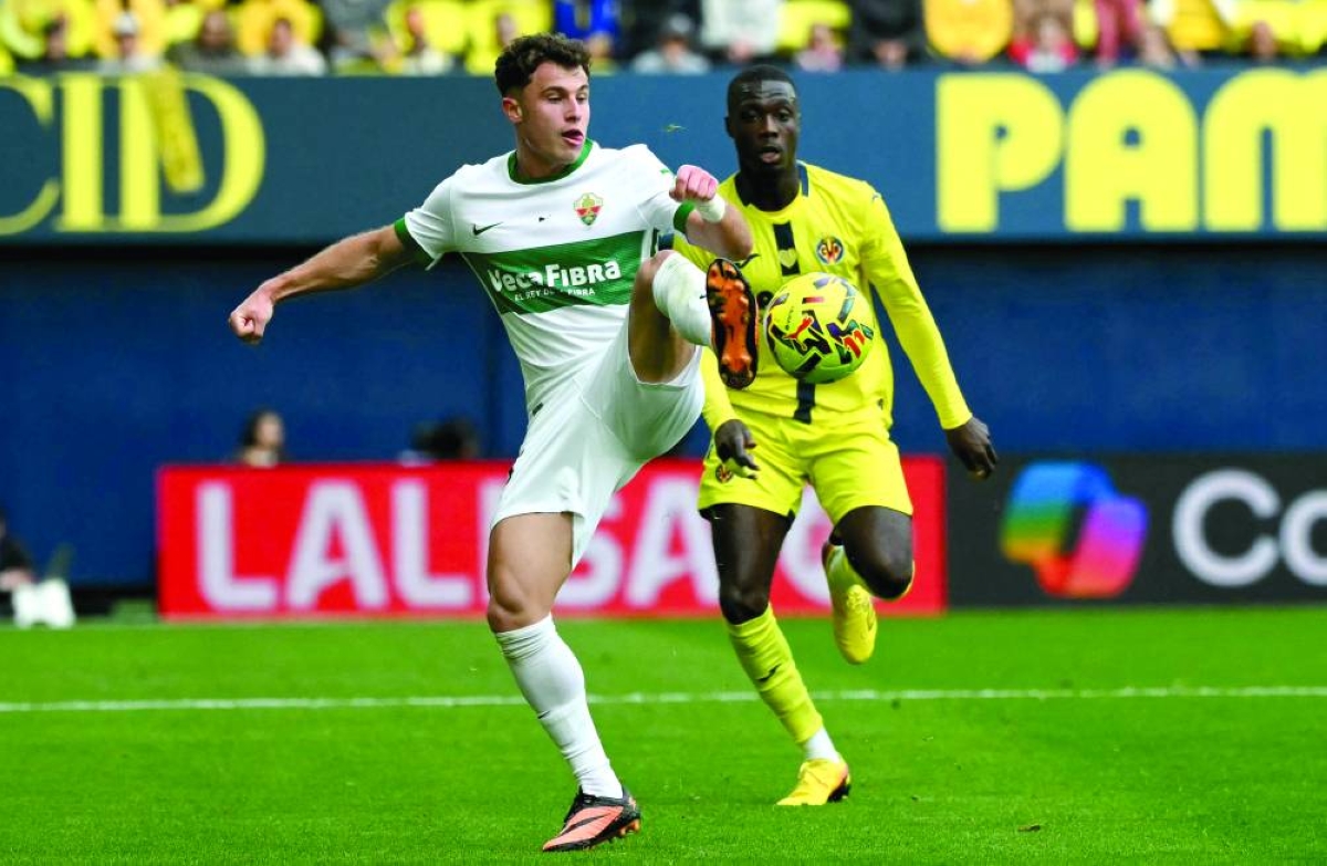 Elche's Spanish forward #11 German Valera fights for the ball with Villarreal's Ivorian forward #19 Nicolas Pepe during the Spanish league football match between Villarreal CF and Elche CF at La Ceramica Stadium in Vila-real on March 8, 2026. (AFP)