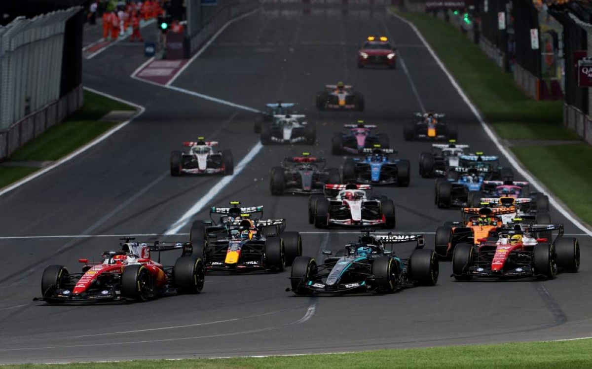 Formula One F1 - Australian Grand Prix - Albert Park Grand Prix Circuit, Melbourne, Australia - March 8, 2026
Ferrari's Charles Leclerc in action as he leads into the first corner at start of the race ahead of  Mercedes' George Russell. REUTERS