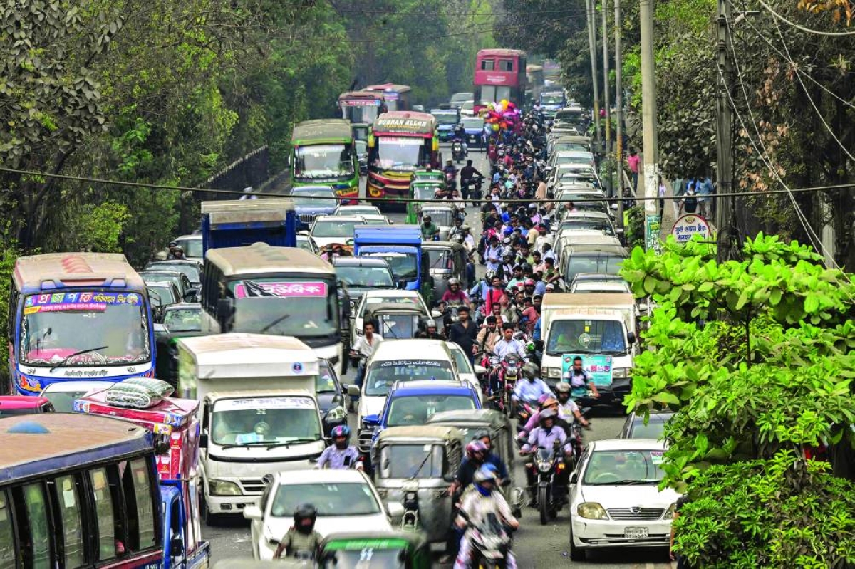 People wait in a queue to refuel their vehicles near a fuel station in Dhaka, Bangladesh on Sunday. Asia’s energy-importing economies are scrambling to contain the impact of a widening Middle East war that has upended oil and gas markets and is now battering ordinary buyers, from farmers to car manufacturers and crematorium operators.