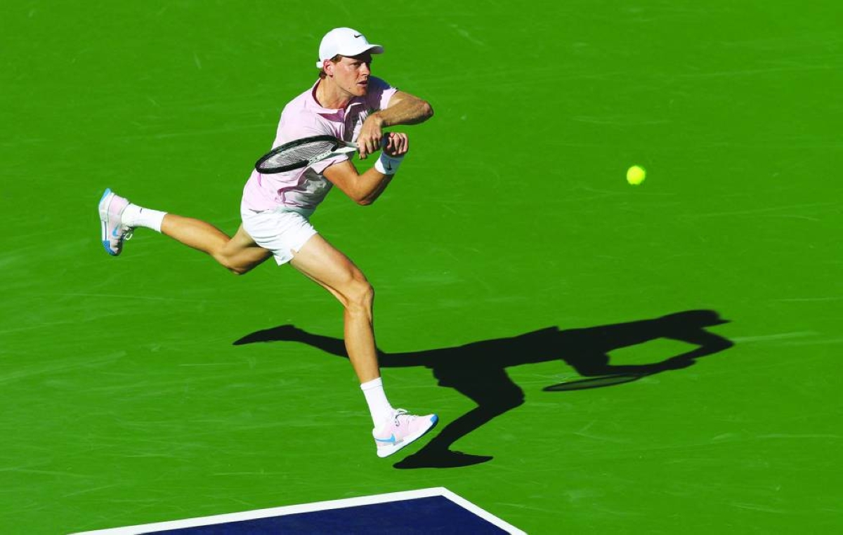INDIAN WELLS, CALIFORNIA - MARCH 08: Jannik Sinner of Italy plays a backhand against Denis Shapovalov of Canada in their third round match of the BNP Paribas Open at Indian Wells Tennis Garden on March 08, 2026 in Indian Wells, California.  (AFP)