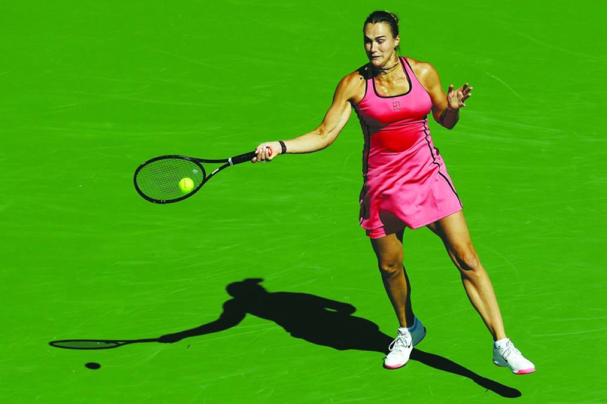 INDIAN WELLS, CALIFORNIA - MARCH 10: Aryna Sabalenka returns a shot to Naomi Osaka of Japan during Day 7 of the BNP Paribas Open at the Indian Wells Tennis Garden on March 10, 2026 in Indian Wells, California.  (AFP)