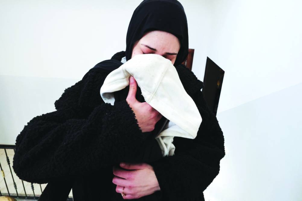 Malak Beirat, 26, mourns her husband Thaer Hamayel after he was killed during an attack by Israeli settlers on the Palestinians in the village of Abu Falah near Ramallah, in the occupied West Bank. (Reuters)