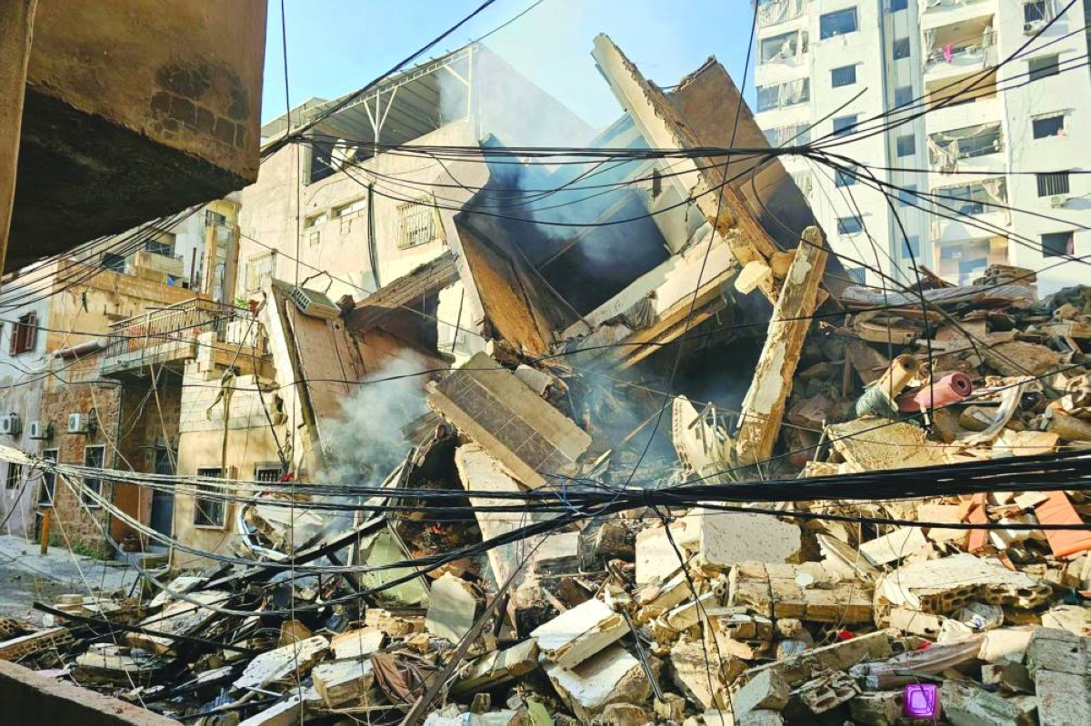 Smoke rises from an Israeli airstrike that targeted a building in Ruwais neighborhood in Beirut’s southern suburbs, Wednesday. (AFP)