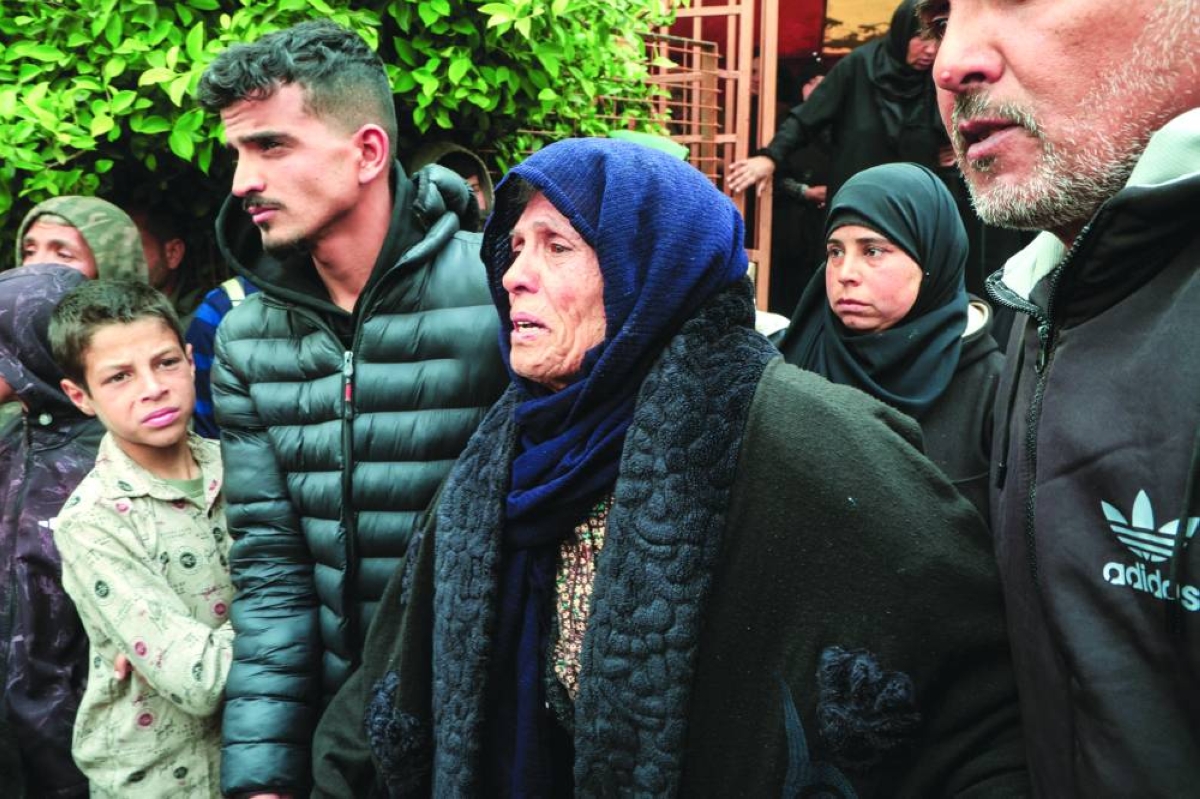 Mourners attend the funeral of Palestinians killed in an overnight Israeli strike, according to medics, at Nasser Hospital in Khan Younis, in the southern Gaza Strip, Saturday. (Reuters)
