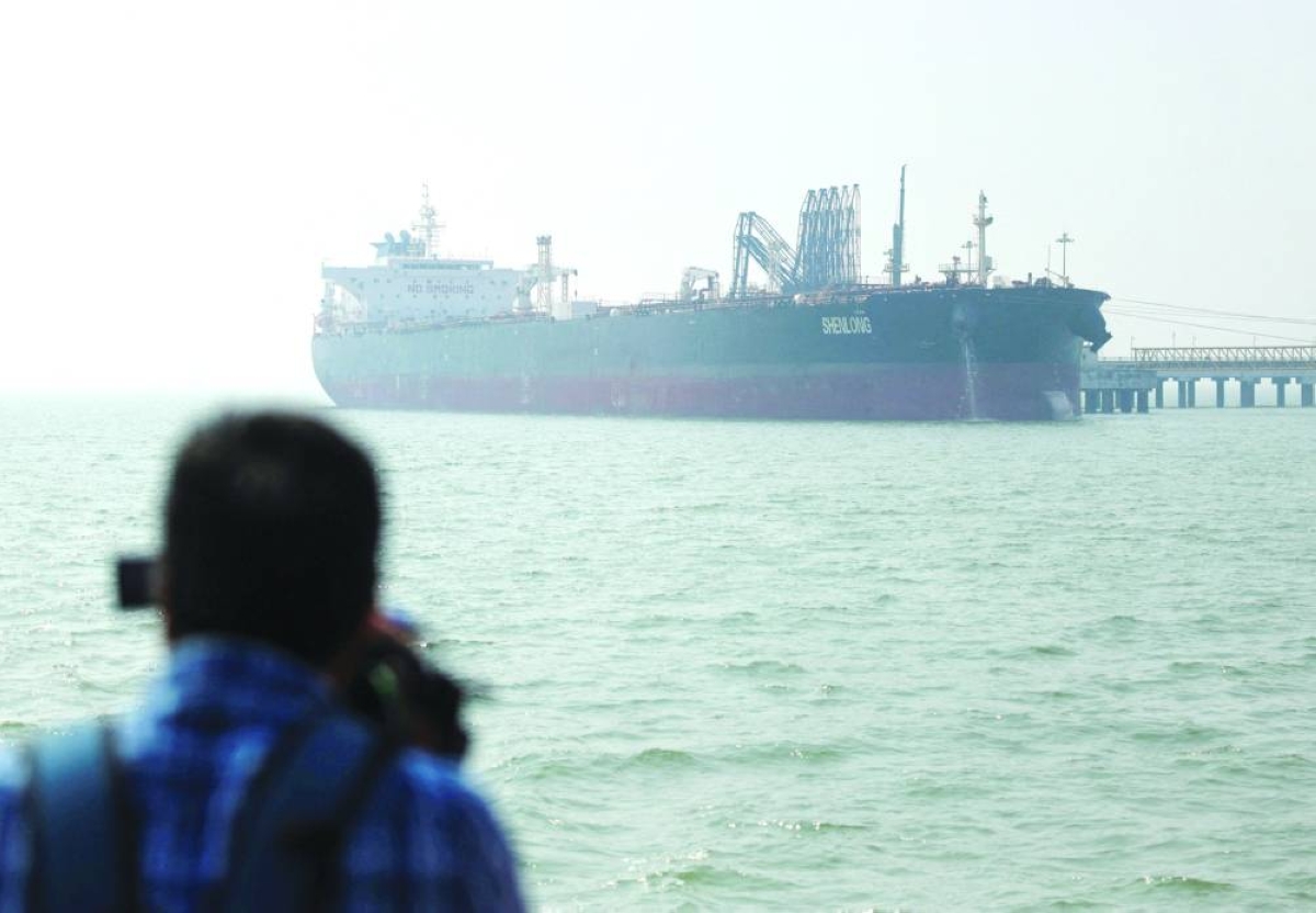 The Liberia-flagged tanker Shenlong Suezmax, loaded with crude, arrives at a port after transiting the Strait of Hormuz amid supply disruptions fears linked to the US-Israeli conflict with Iran, in Mumbai, India, on Thursday. The country imports nearly 90% of its annual crude requirements.
