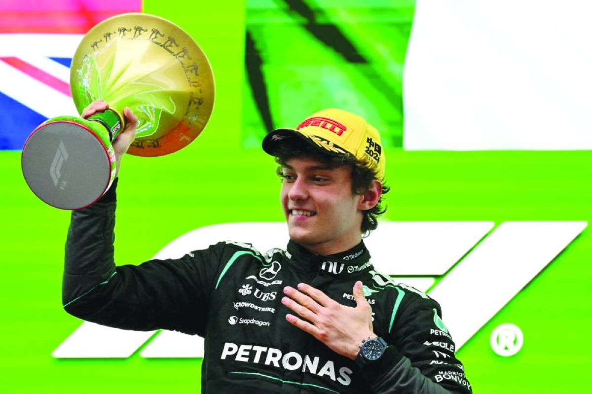 Winner Mercedes' Italian driver Kimi Antonelli celebrates on the podium after the Formula One Chinese Grand Prix at the Shanghai International Circuit in Shanghai on March 15, 2026. (AFP)