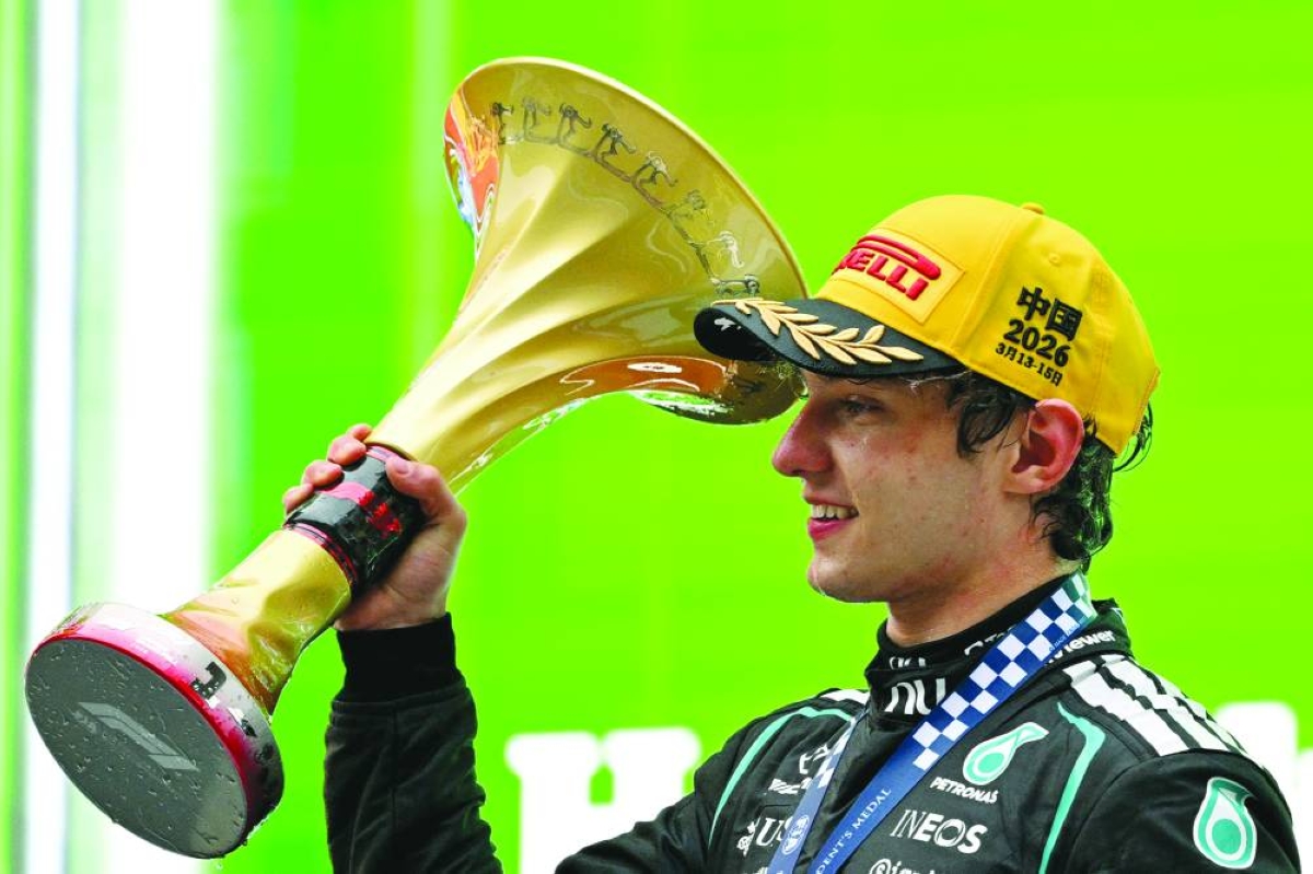 Winner Mercedes' Italian driver Kimi Antonelli celebrates on the podium after the Formula One Chinese Grand Prix at the Shanghai International Circuit in Shanghai on March 15, 2026. (AFP)