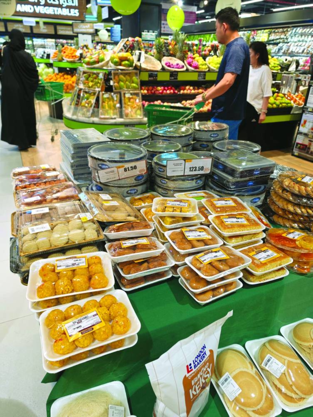 Eid sweets and desserts are displayed at a supermarket counter, with shoppers stocking up on traditional treats typically shared with family and guests during the holiday. PICTURE: Joey Aguilar