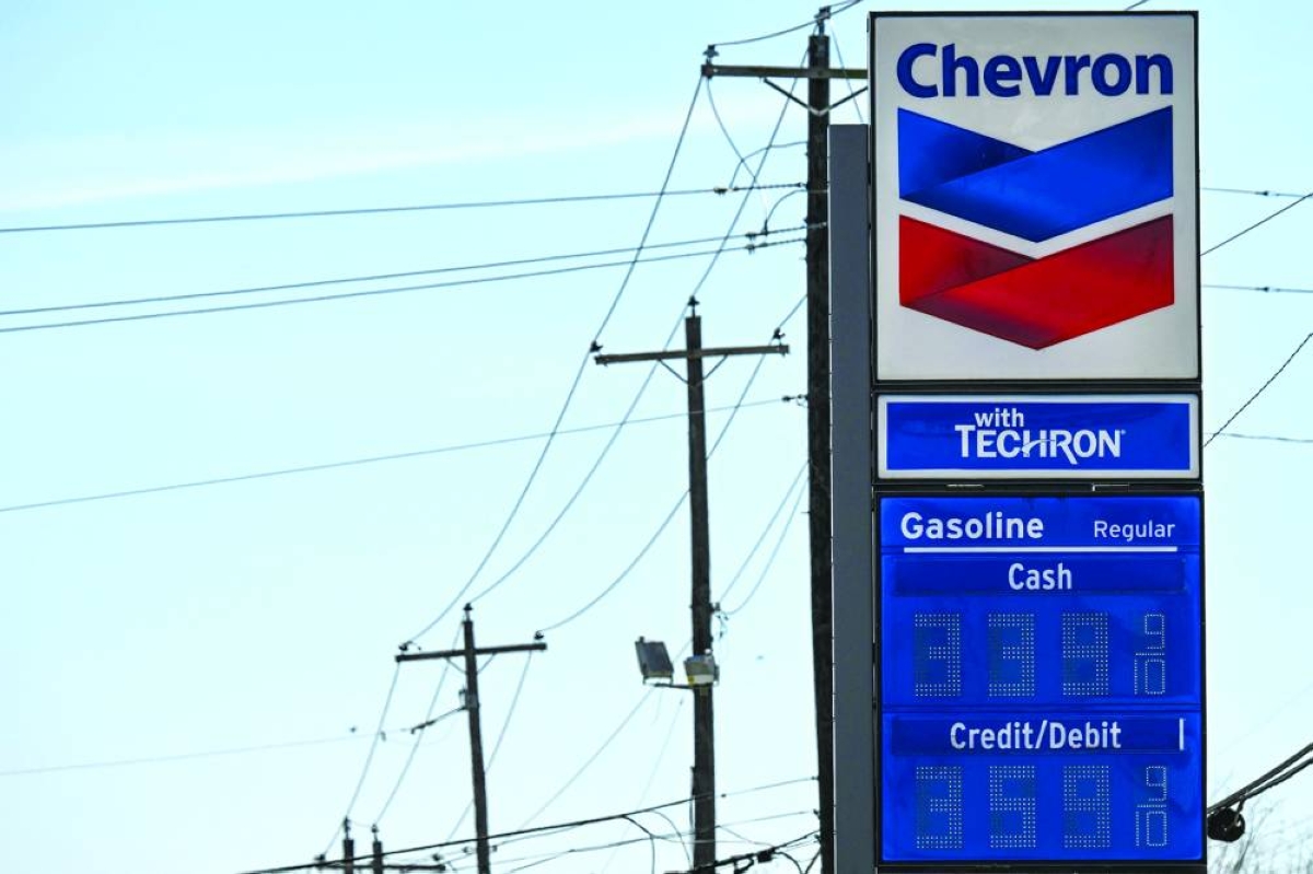 Gasoline prices are seen at a Chevron station in Houston, Texas, on Monday. Any extended period of high energy costs threatens tipping the US economy into a recession while also keeping upward pressure on inflation, a rare economic predicament known as stagflation.