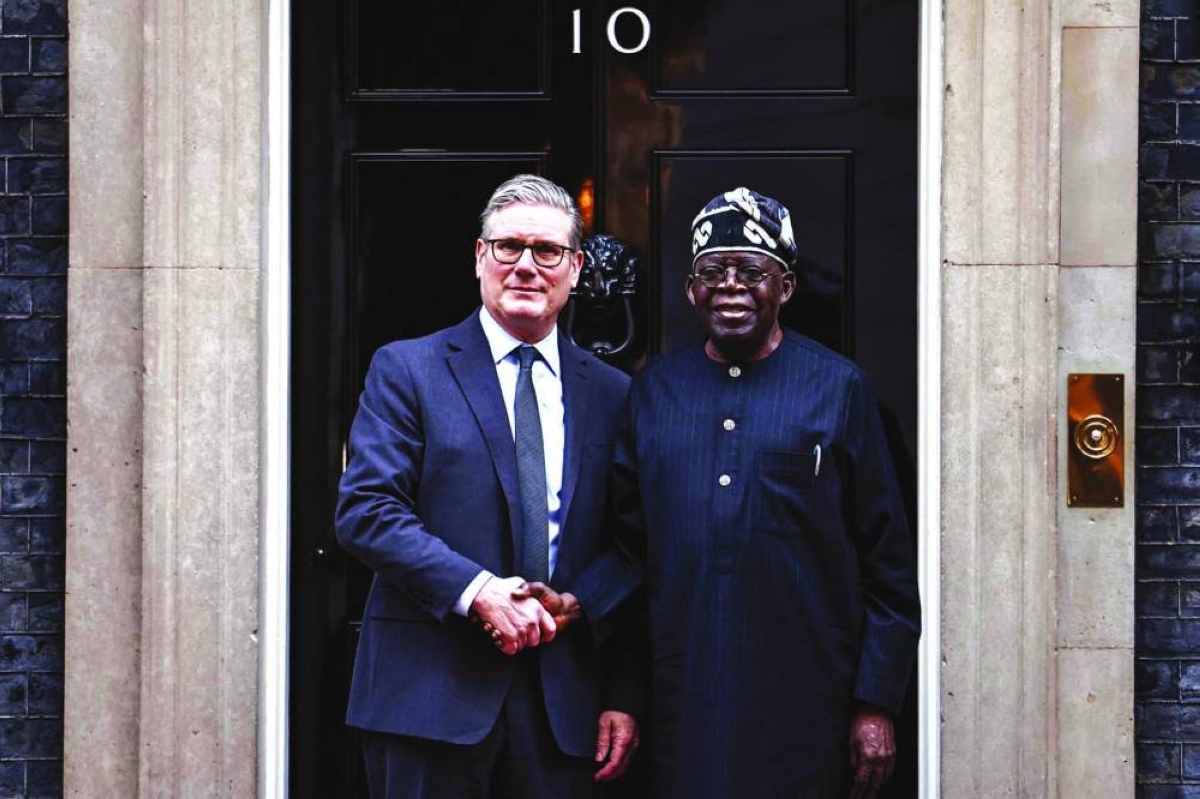 Britain's Prime Minister Keir Starmer greets Nigeria's President Bola Tinubu on the steps of 10 Downing Street in central London Thursday, ahead of their meeting on the second day of a two-day state visit to the United Kingdom by Nigeria's president. (AFP)