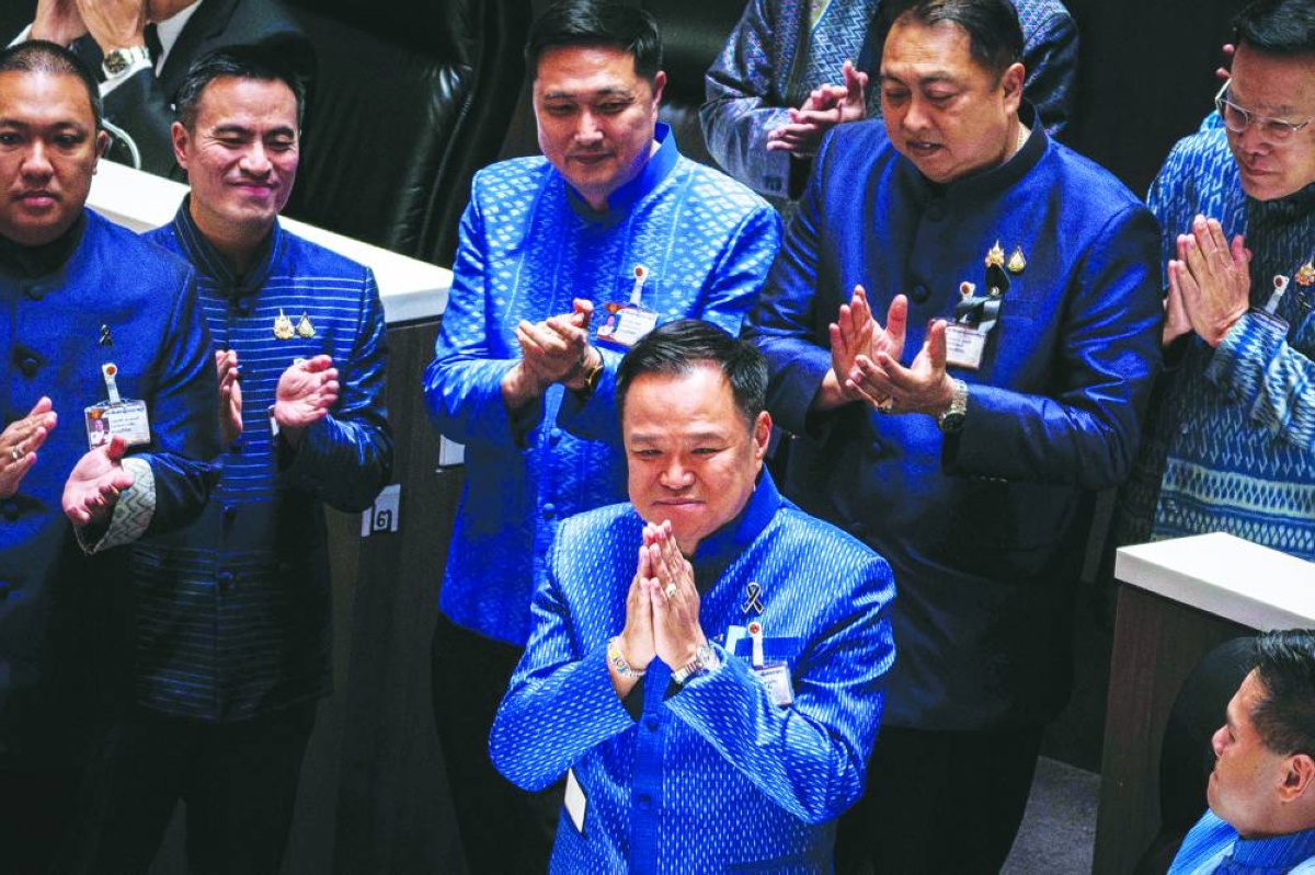 Thailand's caretaker Prime Minister and Bhumjaithai Party leader Anutin Charnvirakul (centre) is applauded by fellow party members after the new parliament elected Anutin as prime minister Thursday. (AFP)